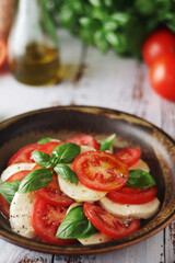 A bowl with traditional Italian caprese salad