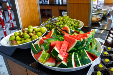 Sliced pieces of ripe juicy watermelon lie on a plate. Fresh fruit.