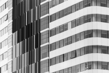 the facade of a modern multi-storey building black and white photo