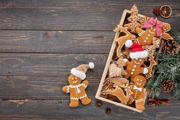 Homemade christmas gingerbread cookies on wooden table.