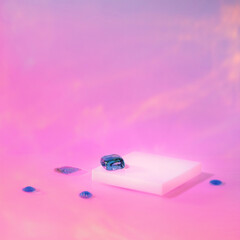 Abstract surreal scene - empty stage with white square podium on holographic pastel pink colored background. Pedestal for cosmetic, beauty product, packaging mockups display presentation