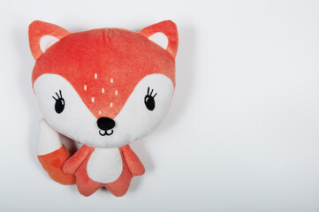 cute soft toy fox on a white background
