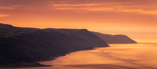 Fototapeta na wymiar Beautiful October evening sunset from Bossington Hill Exmoor with a view over Porlock Bay, Somerset south west England