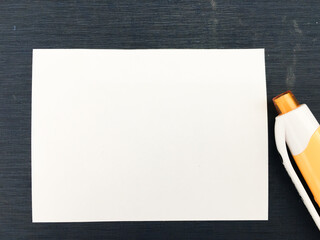 white note paper with a pen for taking notes