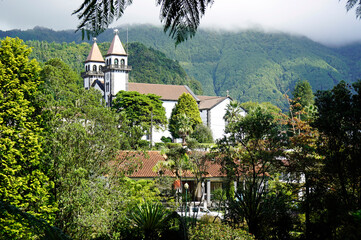 church in deep green forest in furnas