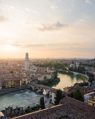 Fototapeta na wymiar Adige river and Ponte Pietra in Verona city at sunset.