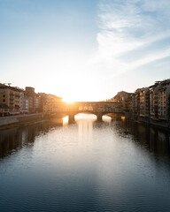 Florence city Ponte Vecchio at sunrise on Arno River, Tuscany.