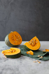 Orange ripe pumpkin and slices