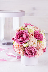 Gift bouquet of marshmallow roses with box and ribbon.