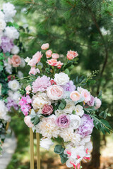 Floral arrangement of roses and greenery on the wedding day. Floral background for wedding invitation or greeting card