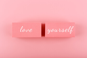 Self love and mental health minimal creative concept in pink colors against pink background. Text...