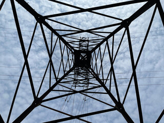 steel structure of rusty beams of electric tower, bottom view, transportation energy