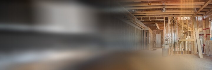 Blurred image of construction with wooden walls and ceiling at empty construction site