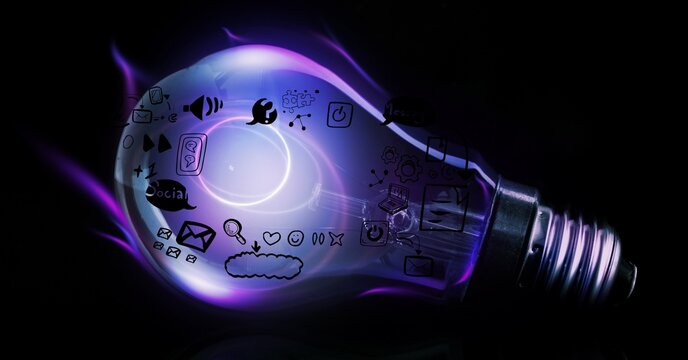 Digitally generated image of glowing light bulb with social networking icons over black background