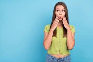 Photo of young dreamy curious shocked woman news look empty space isolated on pastel blue color...