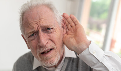 Senior man with hearing problems