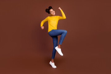 Fototapeta na wymiar Full length photo of teen girl astonished wear sweater jeans sneakers isolated on brown color background