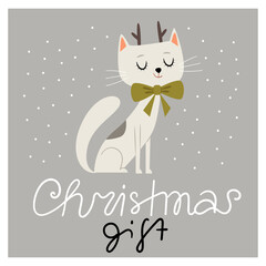 Cute white cat with a green gift bow. Cat with deer horns. A cat as a gift for Christmas.
