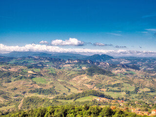 Fototapeta na wymiar San Marino view from the city to the hills by day