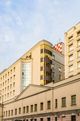 facades of high-rise restored buildings on Bolshaya Lubyanka street in center of Moscow city at sunset.