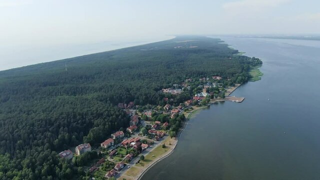 Small town of Juodkrante on coastline of Curonian lagoon, aerial drone view