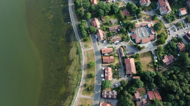 Juokrante town in Lithuania with colorful rooftops, aerial top down view