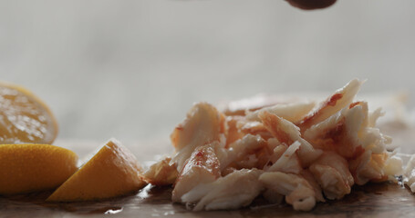 crab with dip sauce on olive wood board