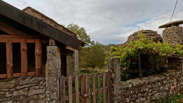 Traveling side of rehabilitated old house, now rural hotels, with old stone bread oven in Branda de Aveleda, Peneda Geres National Park, Portugal.