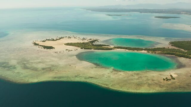 aerial view Honda bay with tropical islands and sandy beaches surrounded by coral reef with azure water, top view. Summer and travel vacation concept, Puerto princesa, Palawan, Philippines.