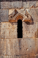 Details and close-up patterns carved in stone on the facade of an ancient monastery or church in Armenia