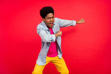 Photo of young african guy happy positive smile dance performer hands clubber disco isolated over red color background