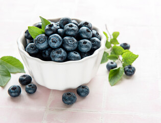 Blueberries on tile background