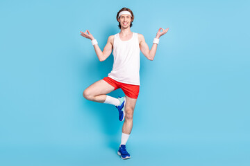 Full body photo of funky young brunet guy stretch wear singlet shorts sneakers socks isolated on...
