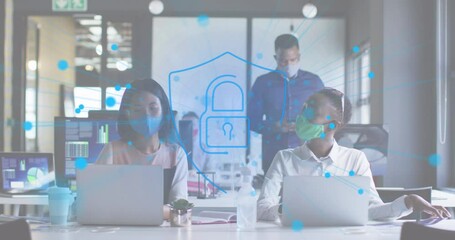 Animation of digital padlock over diverse business people with face masks in office - Powered by Adobe