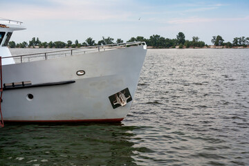 White motor ship stands on water surface © glebchik