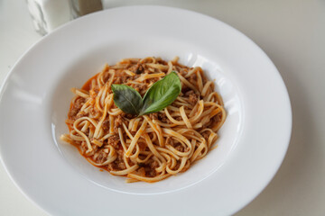 Dish of pasta on round white plate