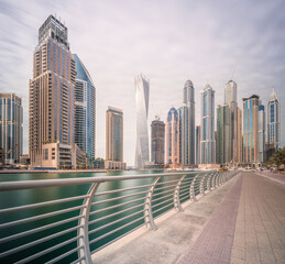 Fototapeta na wymiar Day view of Dubai Marina bay with cloudy sky, UAE
