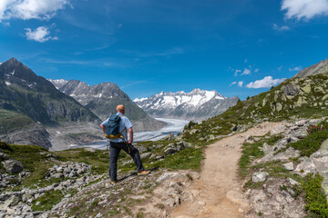 Fototapeta na wymiar Hiker near Riederalp with Aletsch Glacier