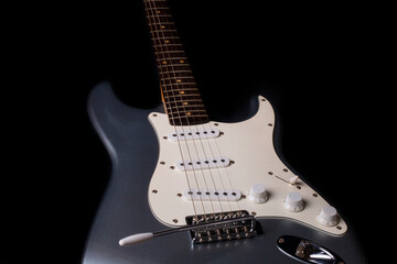 Fototapeta na wymiar Silver electric guitar isolated on black background