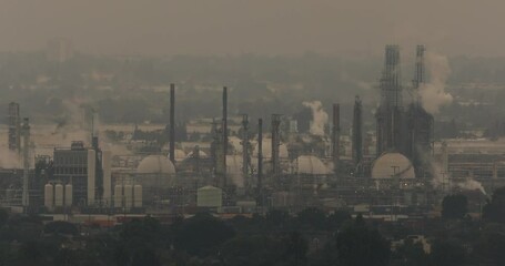 Global warming emissions from oil refining pollute the sky with C02.