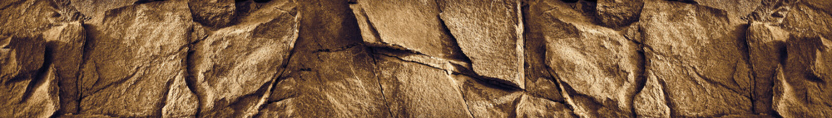 Brown rock texture. Stone background with copy space for design. Wide banner. Website header.