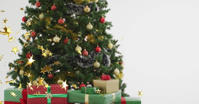 Animation of christmas stars falling over christmas tree
