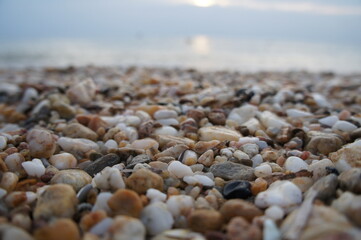 Fototapeta na wymiar Pebbles by the ocean