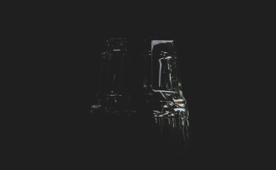glass for whiskey on black matte background