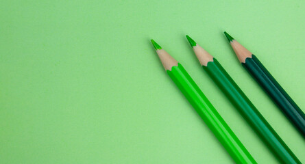 green colored pencils on a green background