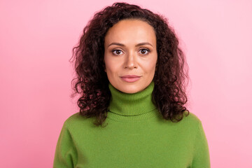 Fototapeta premium Photo of serious beautiful african lady dressed green turtleneck isolated pink color background