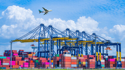 Transportation logistics and container dock cargo yard and cargo plane flying with working crane...