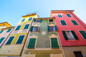 Italy. Traditional colors of the house, walls, doors, windows. - 465951911