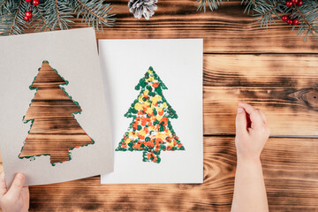 Step-by-step Greeting card Christmas tree with children's fingerprints tutorial. Step 8: Carefully...