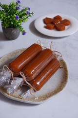 traditional dessert made from glutinous rice cake and palm sugar named dodol jenang in white background